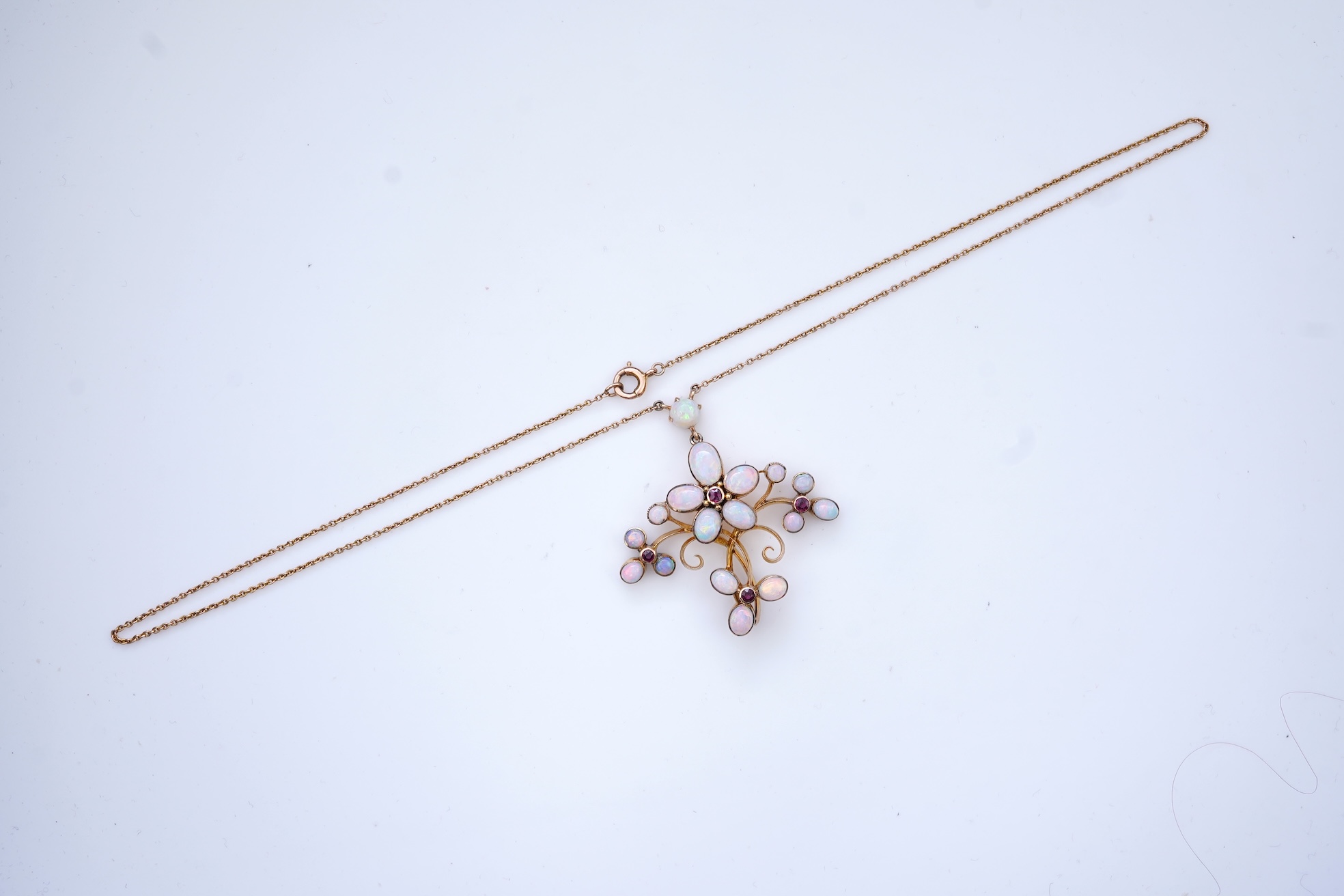 An opal and garnet pendant necklace, circa 1900
